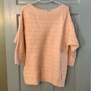 Peach colored cotton cable knit sweater